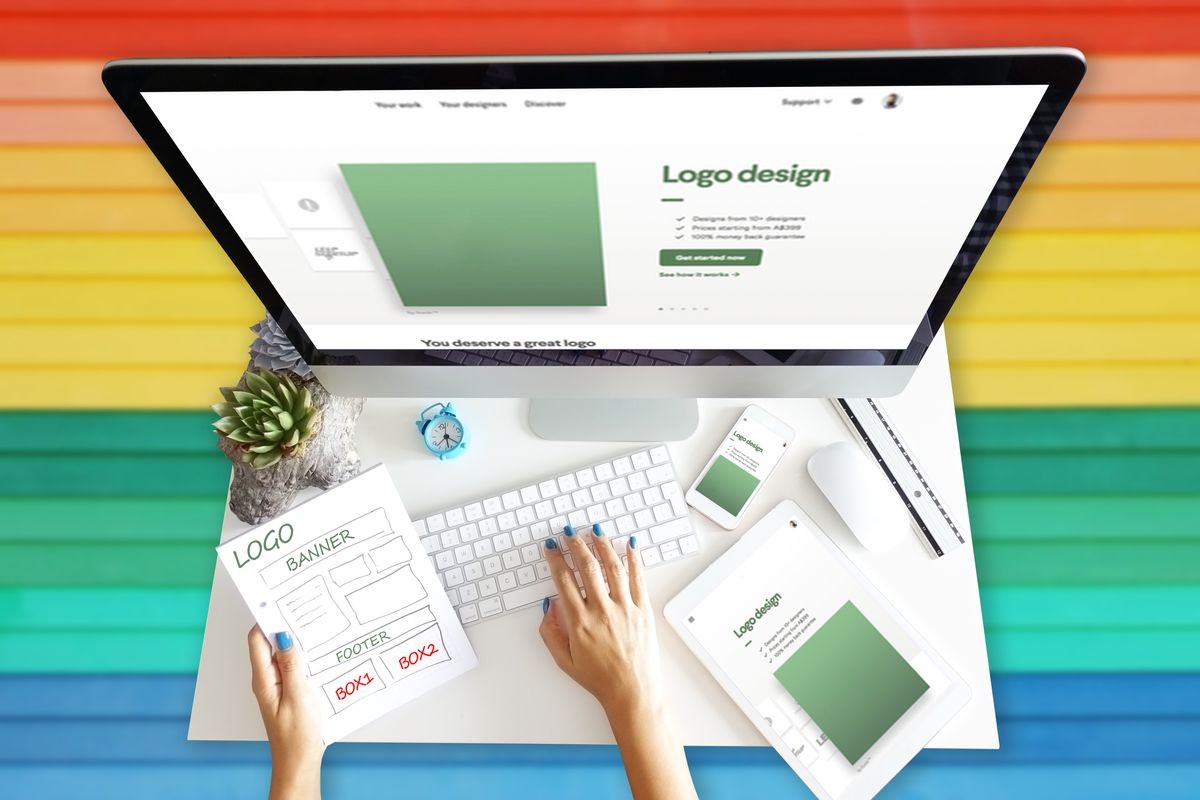 Responsive web design development with computer and different equipment on rainbow background
                              